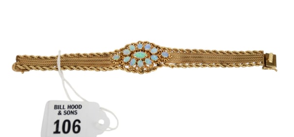 14K Yellow Gold Opal bracelet. 6.5" long 1" at its widest. wt. 32 grams