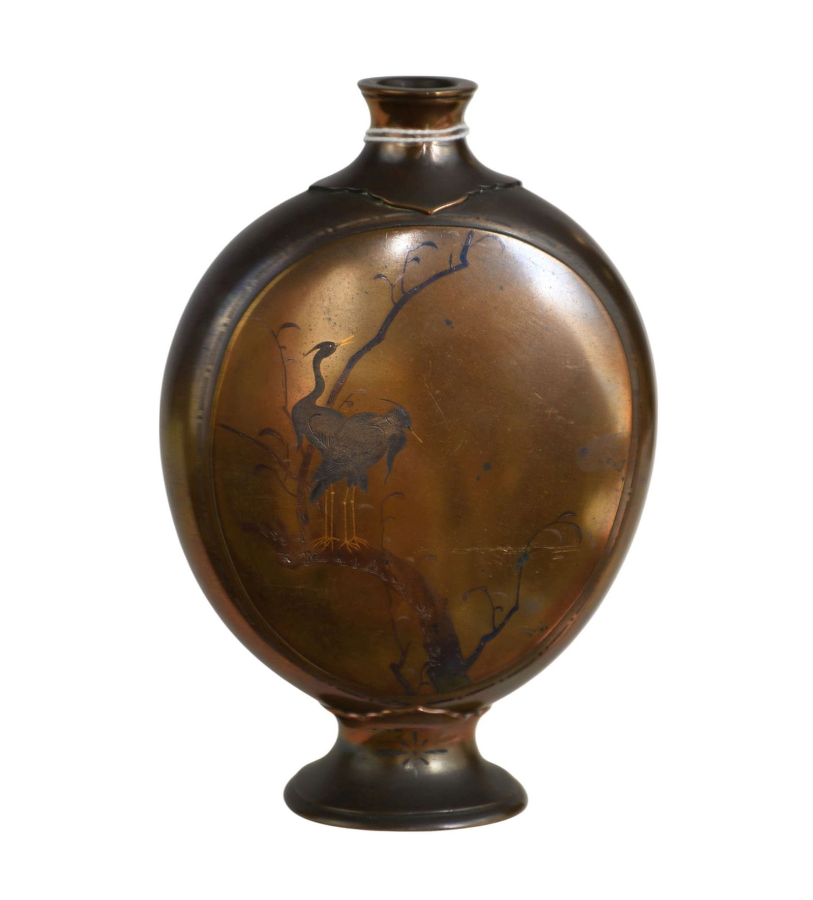 A footed oval mixed metal vase with cranes resting on branches, No apparent signature H. 6 ¼: A footed oval mixed metal vase with cranes resting on branches, No apparent signature H. 6 ¼”
