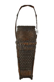 Anique Japanese basket bamboo elongated woven footed basket with elaborate double-twined handle.