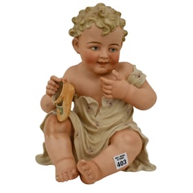 Seated Piano Baby, Made in Germany, 13"h x 9"w x 11"d (leg repair)