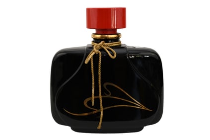 MAXIMES DI PARIS Porcelain Oversized Perfume Bottle, 20th Century, With incised gold design and red