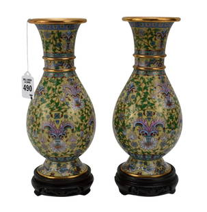 Pair Chinese Cloisonne Enamel Vases - A pair of Chinese cloisonne enameled vases with pear shaped: Pair Chinese Cloisonne Enamel Vases - A pair of Chinese cloisonne enameled vases with pear shaped bodies, flaring rims and a flared foot base. Yellow ground with floral and foliate scrolling motifs in