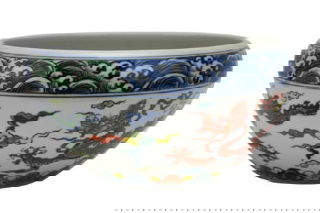 Chinese Wucai Porcelain Bowl, Dragon Motif - A deep tapered base bowl with an inverted rim. Wucai: Chinese Wucai Porcelain Bowl, Dragon Motif - A deep tapered base bowl with an inverted rim. Wucai style decoration with blue underglaze and red, yellow and green overglaze enamels. Dragon motif to ext