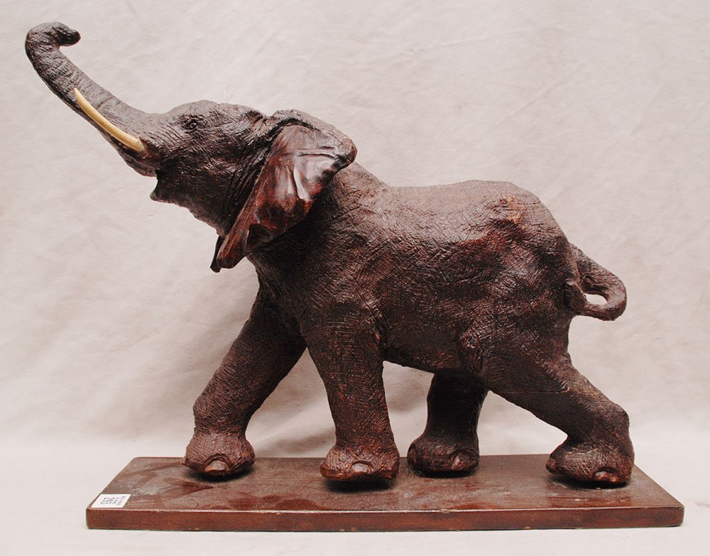 Carved African wood elephant with tusks on stand, 15 1/: Carved African wood elephant with tusks on stand, 15 1/2"h x 17 1/2"w