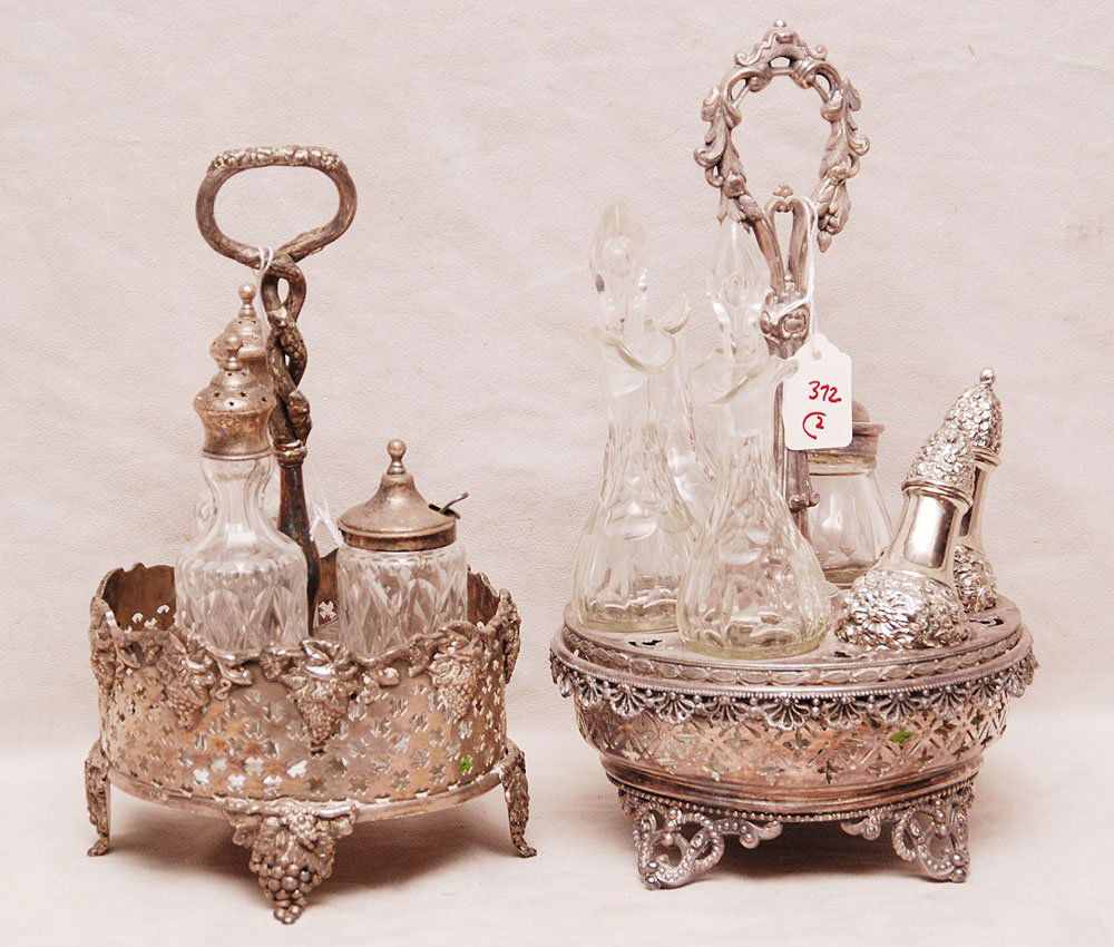Two Victorian silver plate castors both incomplete: 1 : Two Victorian silver plate castors both incomplete: 1 has 4 bottles & 2 S.P salt & peppers, non fitting and glass stopper missing 13"h x 7 1/2"L, 1 has three bottles missing 2, 11 1/2"h x 7"L