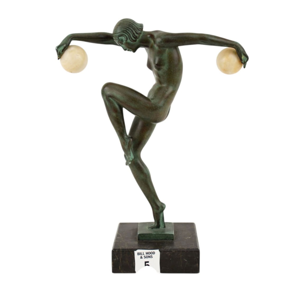 Max Le Verrier (French, 1891-1973) Art Deco Nude - A verdigris patinated metal sculpture of an Art: Max Le Verrier (French, 1891-1973) Art Deco Nude - A verdigris patinated metal sculpture of an Art Deco nude female dancer with two onyx balls in her hands. The base signed "Denis", "LE VERRIER" and h