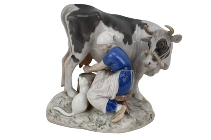 Royal Copenhagen Porcelain Grouping, Maiden Milking Cow, 7 1/2"h x 8"w