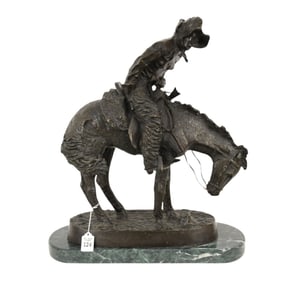 After Frederic Remington "Norther" Bronze Sculpture - Patinated bronze cowboy on a horse. Open