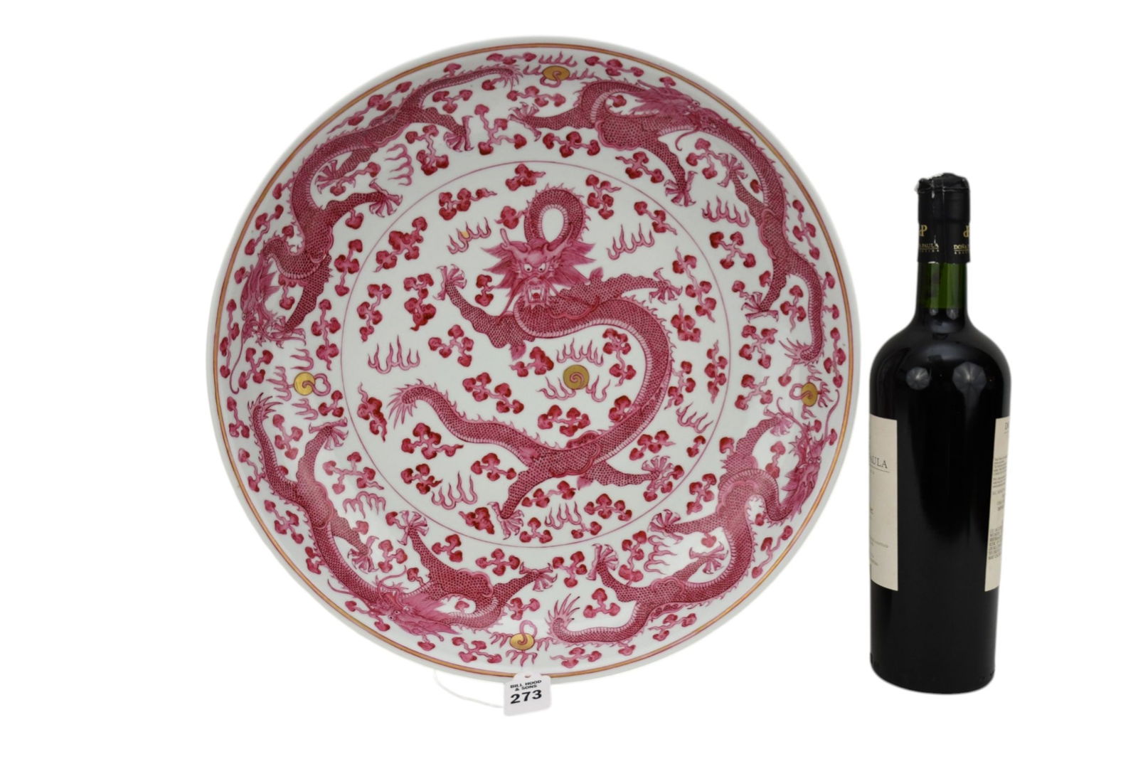 Chinese Porcelain Dragon Charger -  A large shallow porcelain bowl, dragon motif in cranberry red (1 of 8)