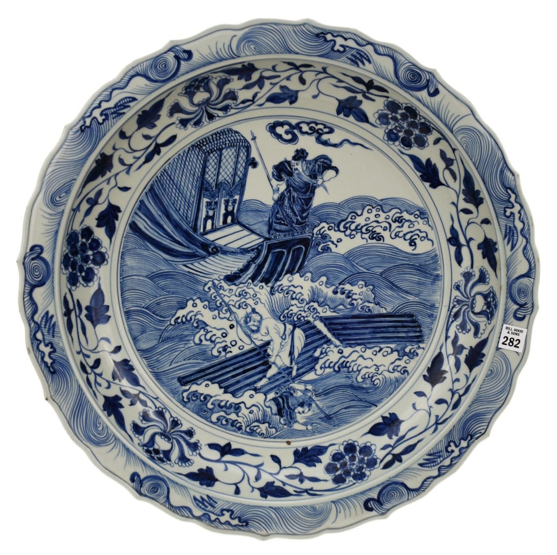 Chinese Blue & White Porcelain Charger - An extra large porcelain shallow bowl, scalloped rim. Blue: Chinese Blue & White Porcelain Charger - An extra large porcelain shallow bowl, scalloped rim. Blue underglaze decoration with a central figural scene depicting immortal figures on a sea battle, bands
