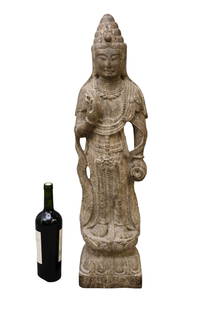 Large Chinese Carve Stone Sculpture of Guanyin - Carved depicting the standing bodhisattva on a: Large Chinese Carve Stone Sculpture of Guanyin - Carved depicting the standing bodhisattva on a lotus base. The sides of the base incised with numerous characters. 31" h. Condition: Normal wear commen
