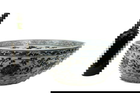Large Chinese Blue & White Porcelain Bowl - A large and deep porcelain bowl. Dark blue-black: Large Chinese Blue & White Porcelain Bowl - A large and deep porcelain bowl. Dark blue-black underglaze decoration on a white ground. Decorated with / heads, chrysanthemum, lotus and classic scroll. 1