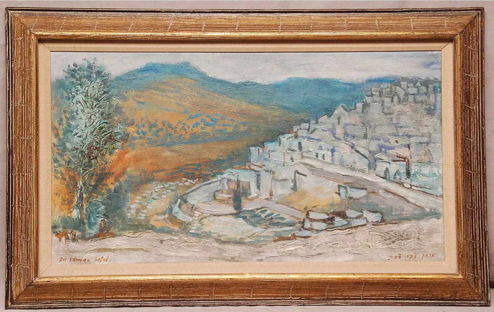 Zvi Ehrman (Polish/Israeli 1903-1993). Oil on canvas depicting Safed with a dated label verso Nov: Zvi Ehrman (Polish/Israeli 1903-1993). Oil on canvas depicting Safed with a dated label verso Nov 12, 1961. Signed Lower left & bottom right. 13" x 24"& 18"x28"with gilded frame