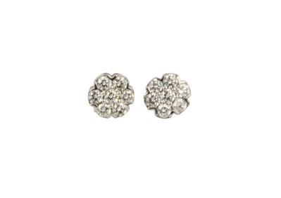 14K white gold Diamond Earrings. Floral shape each earrings has 7 faceted diamonds .20 each SI1 G.