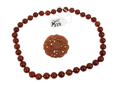 39 Carnelian Beads, 11mm, knotted and strung, 22"L And Carnelian Motif Medallion