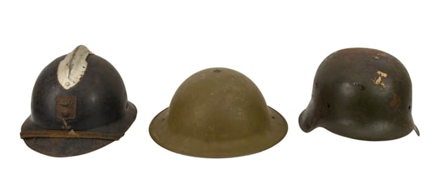 Three WW2 Military Helmets, German, French, UK - Three World War II era metal helmets. C.