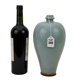 Chinese Pale Blue Celadon Porcelain Vase - A porcelain vase with a tapering ovoid body and short