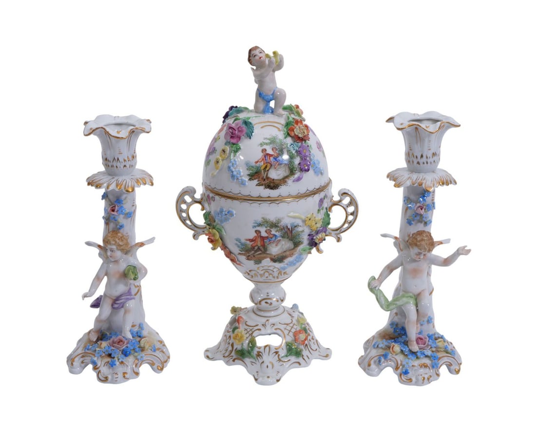 Group of German Porcelain, Carl Thieme Dresden & Schierholz - c. Early to mid 20th century. Three: Group of German Porcelain, Carl Thieme Dresden & Schierholz - c. Early to mid 20th century. Three pieces of German porcelain. Each having a white ground with polychrome florals, cherubs, and gilt acce