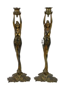 Pair of French Art Nouveau Candlesticks - C. Early 20th Century. A pair of patinated spelter