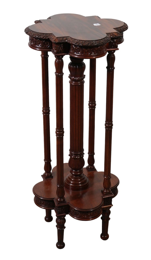 Mahogany Pedestal, Clover Shape Top above 5 Columns on Clover Shape: Mahogany Pedestal, Clover Shape Top above 5 Columns on Clover Shape Base, 44"h x 18"w ***If this item is not picked up by the Friday following the auction, it will be moved to offsite storage and pick