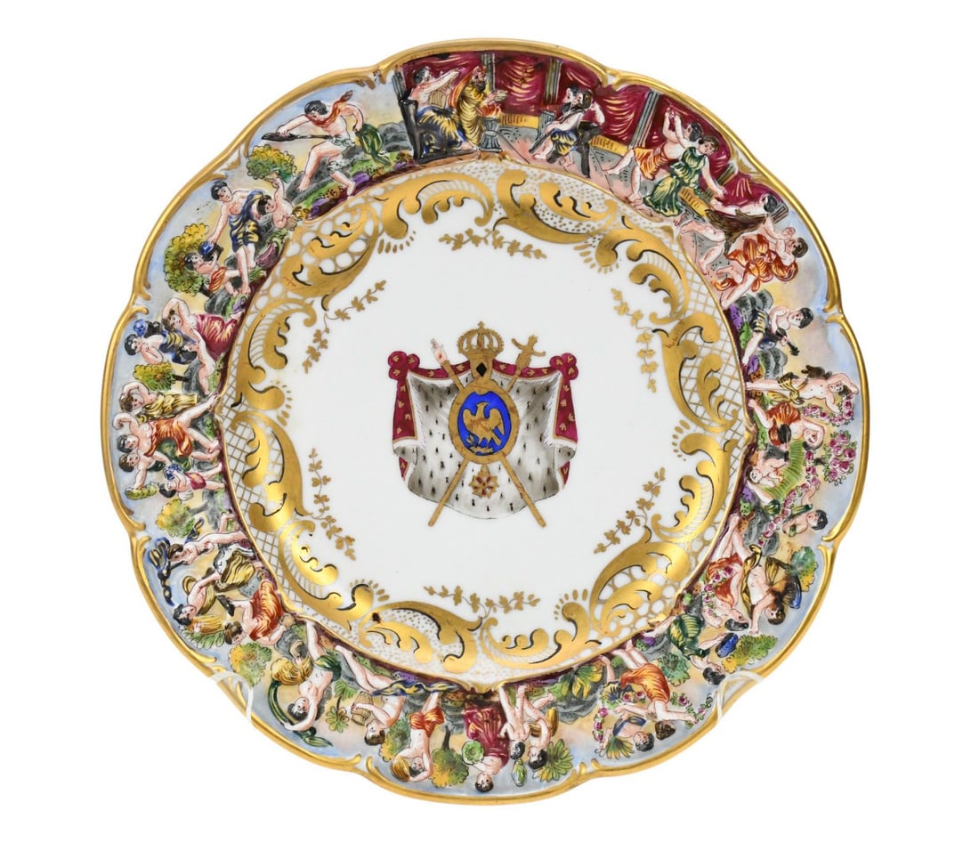 Antique Capodimonte single plate, relief decorated border with painted crest in center, 8-3/4: Antique Capodimonte single plate, relief decorated border with painted crest in center, 8-3/4 diameter.