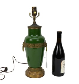 Green Porcelain lamp with brass mounts and lion rings, 19"h x 8"w