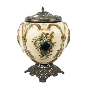 Antique Majolica Jardiniere; iron base and lid; white background with blue and gold swag adornments,
