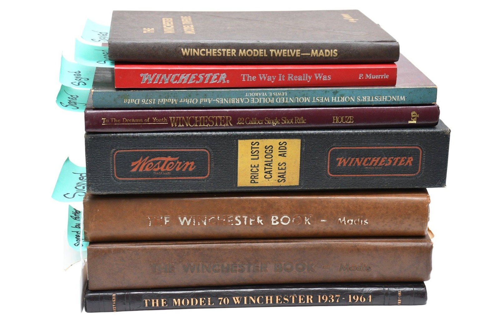 Group of Winchester Firearms Books, Many Signed - Eight vintage books about Winchester firearms.: Group of Winchester Firearms Books, Many Signed - Eight vintage books about Winchester firearms. Comprising: A) The Winchester Model Twelve, by George Madis (1982), signed by author. B) Winchester: Th