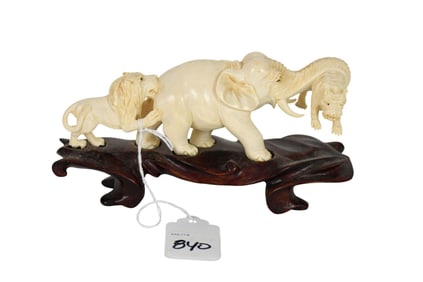 Small tiger, elephant and lion carving 6 inches long 2 inches tall on a 1 inch tall base, tiger is
