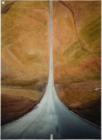 Slim Aarons style photograph, 20th c. Country road with curvature view, which makes road look as