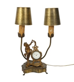 A Two-Light Lamp with Figural Clock, C. second quarter 20th Century - An antique lamp with figural