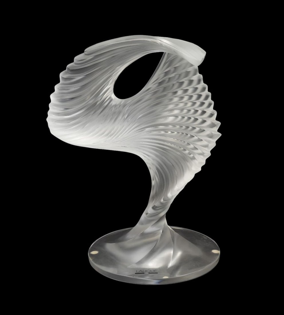 Lalique France 'Trophee' Crystal Sculpture - A Lalique crystal modernist sculpture, clear frosted: Lalique France 'Trophee' Crystal Sculpture - A Lalique crystal modernist sculpture, clear frosted and polished glass. Signed on edge of base, original decal. 13" h x 9" . Condition: Very good with no