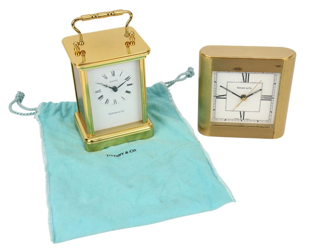 2 Tiffany & Co. Quartz Clocks, Carriage Clock (4 1/2"h x 3 1/2"w) & Square (4", top piece/panel: 2 Tiffany & Co. Quartz Clocks, Carriage Clock (4 1/2"h x 3 1/2"w) & Square (4", top piece/panel needs to be reattached)