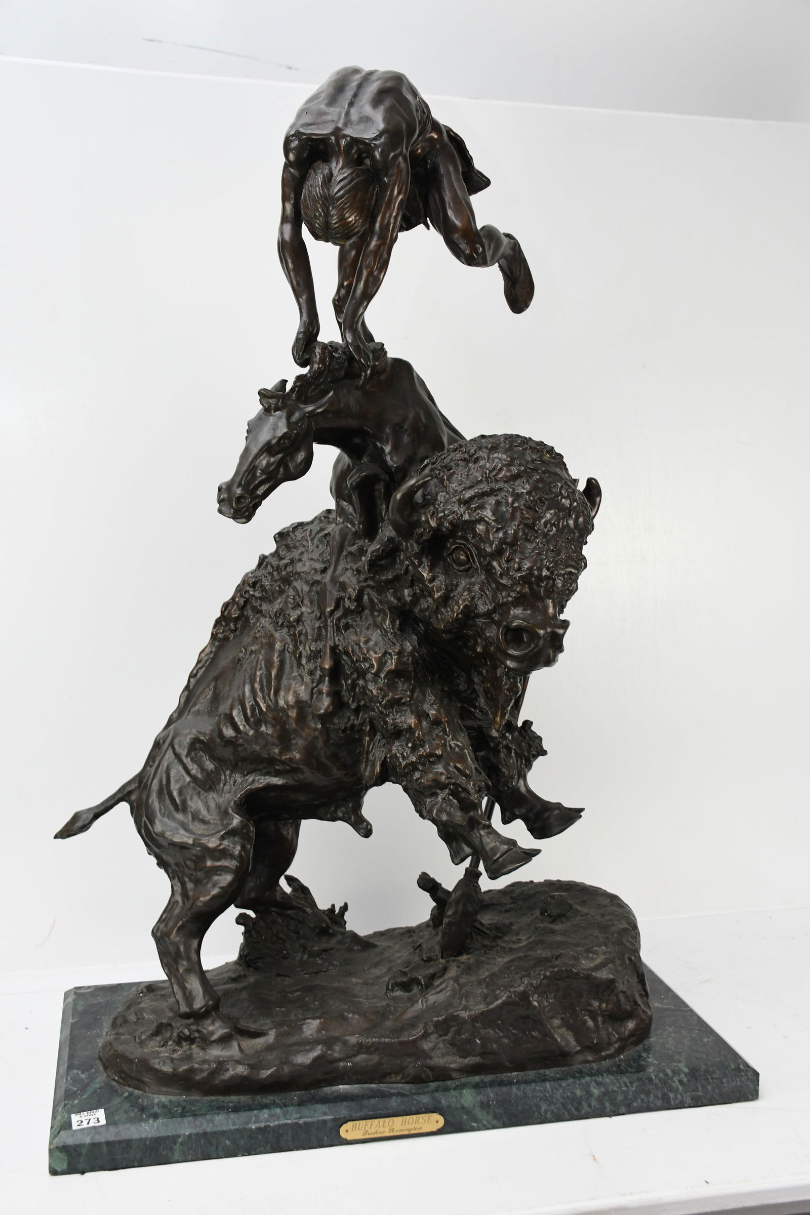 After Frederic Remington "Buffalo Horse" bronze sculpture: After Frederic Remington "Buffalo Horse" bronze sculpture featuring a Native American, a horse and a buffalo. On green marble base. "Frederic Remington" incised into base of sculpture. Plaque on base