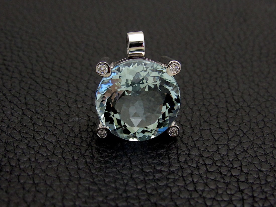 22ct Aquamarine Pendant With Diamonds 18k White: 22ct Aquamarine Pendant With Diamonds 18k White Gold Stylish Aquamarine Pendant handcrafted in 18k white gold. Round cut aquamarine with a very rich sky blue color, with a weight of 22ct (19.1 x 12).