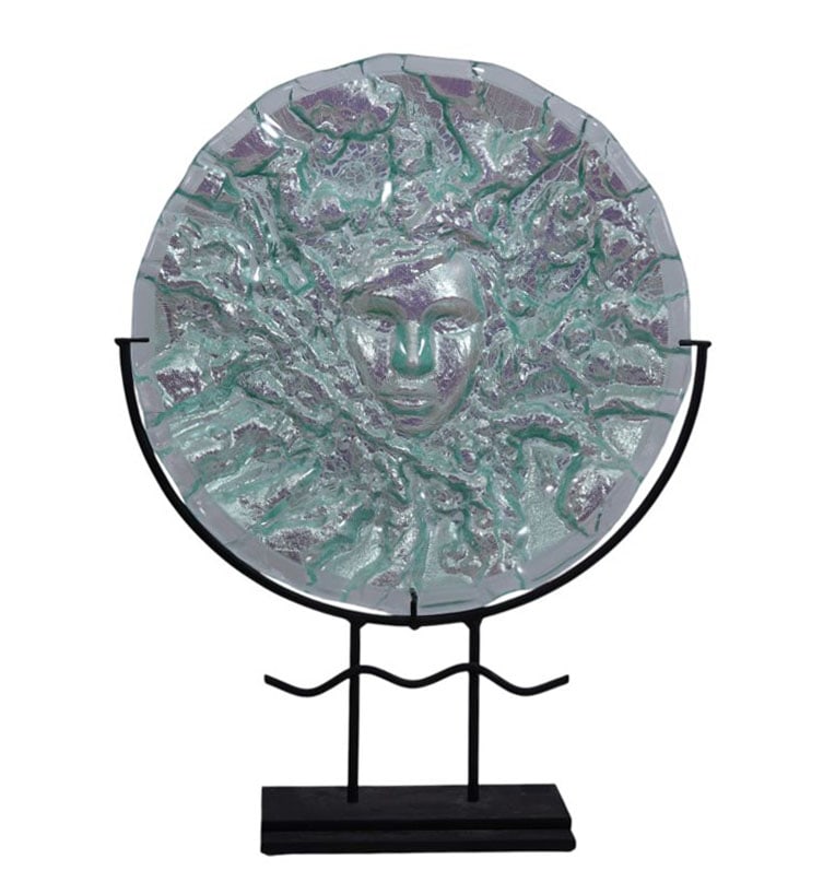 Glass Disc Face Sculpture on Stand. Contemporary Cast Art Glass Tondo- 21st Century. The iridescent: Glass Disc Face Sculpture on Stand. Contemporary Cast Art Glass Tondo- 21st Century. The iridescent clear and pink hue tondo with face molded in relief. Mounted on a custom wrought iron base. No appar