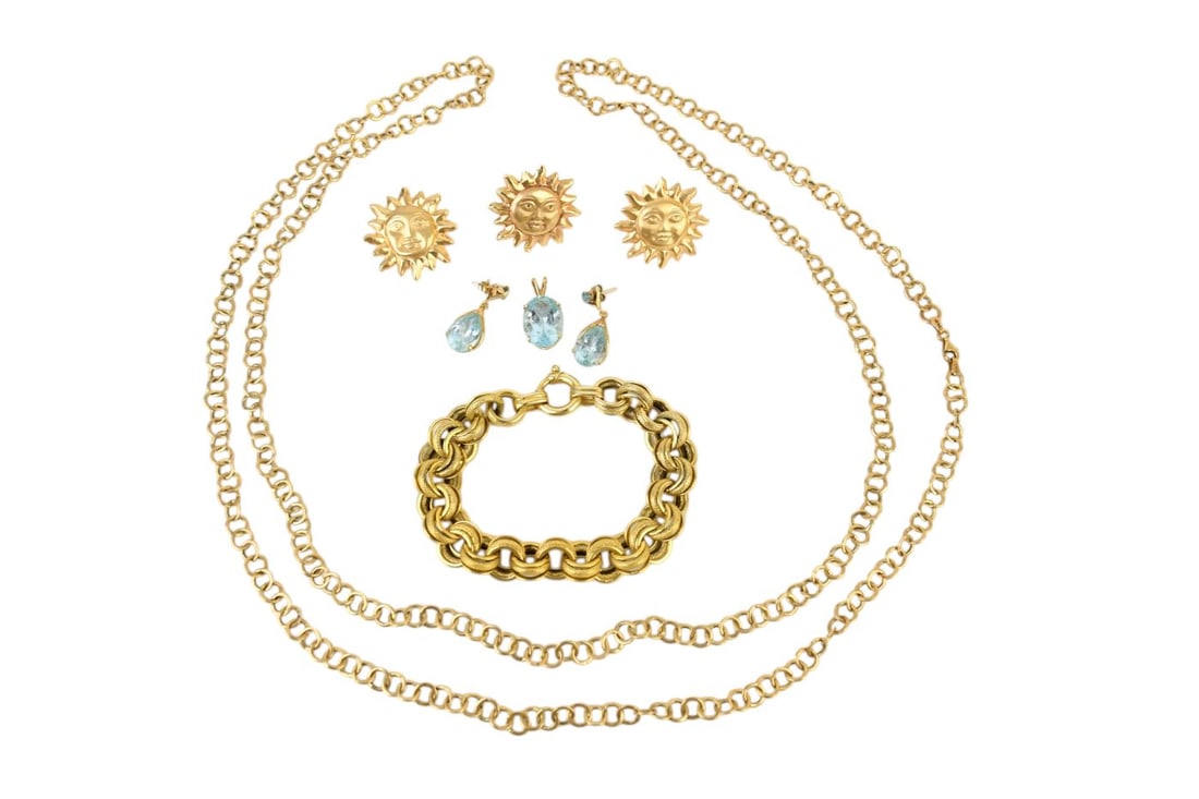 14K Yellow Gold Jewelry Lot. Earrings, Ring, Bracelet, Pendant and Necklace. Wt. 53.7 grams.: 14K Yellow Gold Jewelry Lot. Earrings, Ring, Bracelet, Pendant and Necklace. Wt. 53.7 grams. Necklace 54", bracelet 8", Matching blue topaz earrings and pendant 1" and matching sunburst earrings 1" an