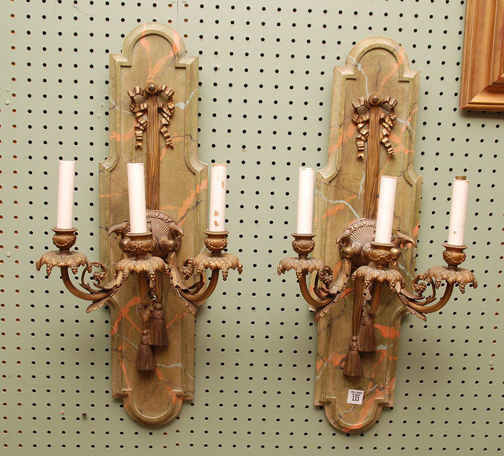 Pair bronze 3 lite wall sconces mounted on faux painted: Pair bronze 3 lite wall sconces mounted on faux painted backs, 27"h x 12"w