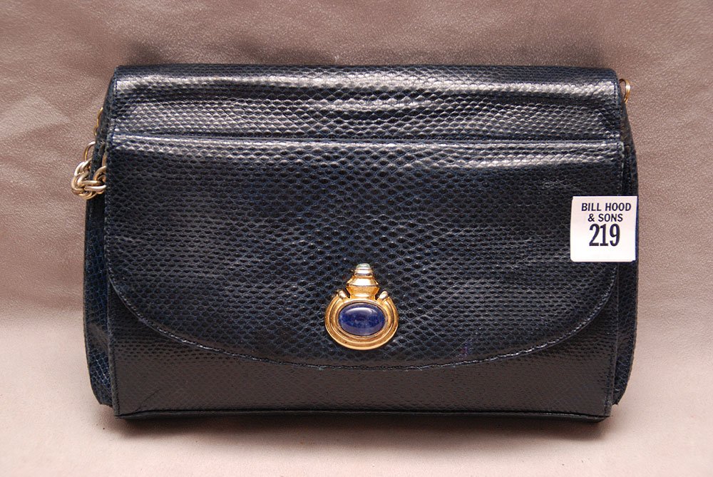 Vintage Judith Lieber Lizard Purse. Clasped with an eme: Vintage Judith Lieber Lizard Purse. Clasped with an emerald and a sapphire cabochon. Comes with a long shoulder rope chain. Overall in good condition. 6" by 9"