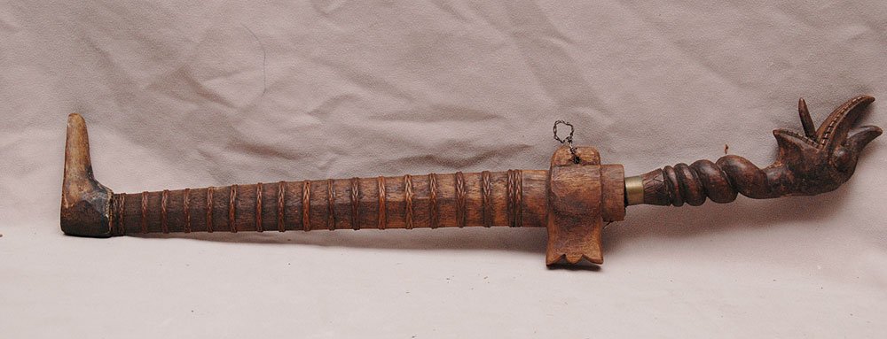 A Rare Antique Wood Carved Snake Charmer Protective Rit: A Rare Antique Wood Carved Snake Charmer Protective Ritual Weapon Dagger. Fine Hand Carved Handle in Shape of a Snake with a hand made Scarab ending in a boot for upright position. The heavy blade of 