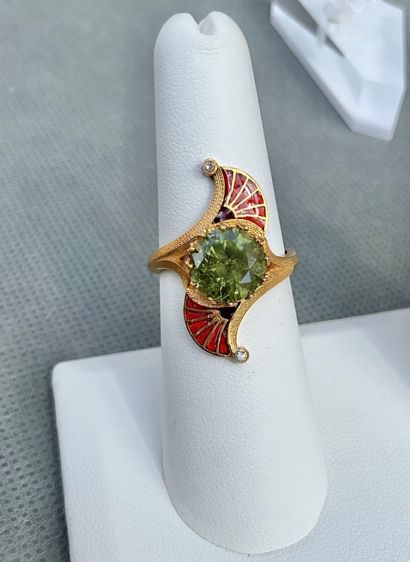 Russian Antique Gold 2.99 ct. GIA Demantoid Garnet ring: Russian Antique Gold 2.99 ct. GIA Demantoid Garnet ring size 7 Beautiful Russian Antique 14kt. gold with 2.99 ct. Demantoid garnet, 2 small single cut diamonds and red enamel, stamped 56 and maker mar
