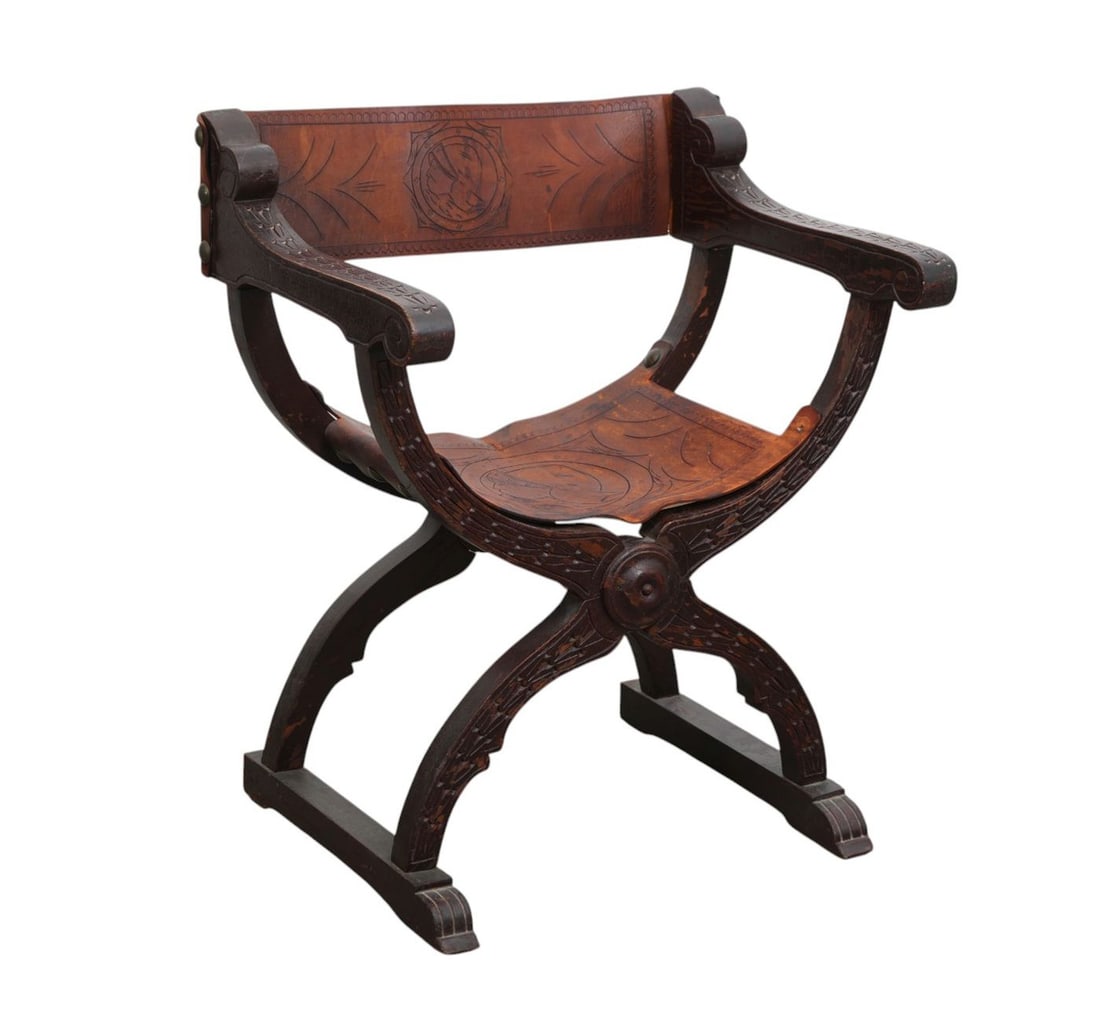 Curule Carved Vintage Chair, Worn Leather Seat and Back, 30"h x 24 1/2"w: Curule Carved Vintage Chair, Worn Leather Seat and Back, 30"h x 24 1/2"w