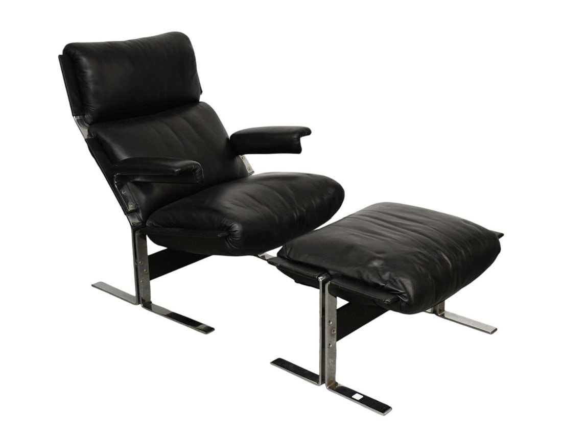 Modern Black Leather Chrome Armchair & Ottoman, Condition: Good ***If this item is not picked up by: Modern Black Leather Chrome Armchair & Ottoman, Condition: Good***If this item is not picked up by the Friday following the auction, it will be moved to offsite storage and pickup will be by appointme