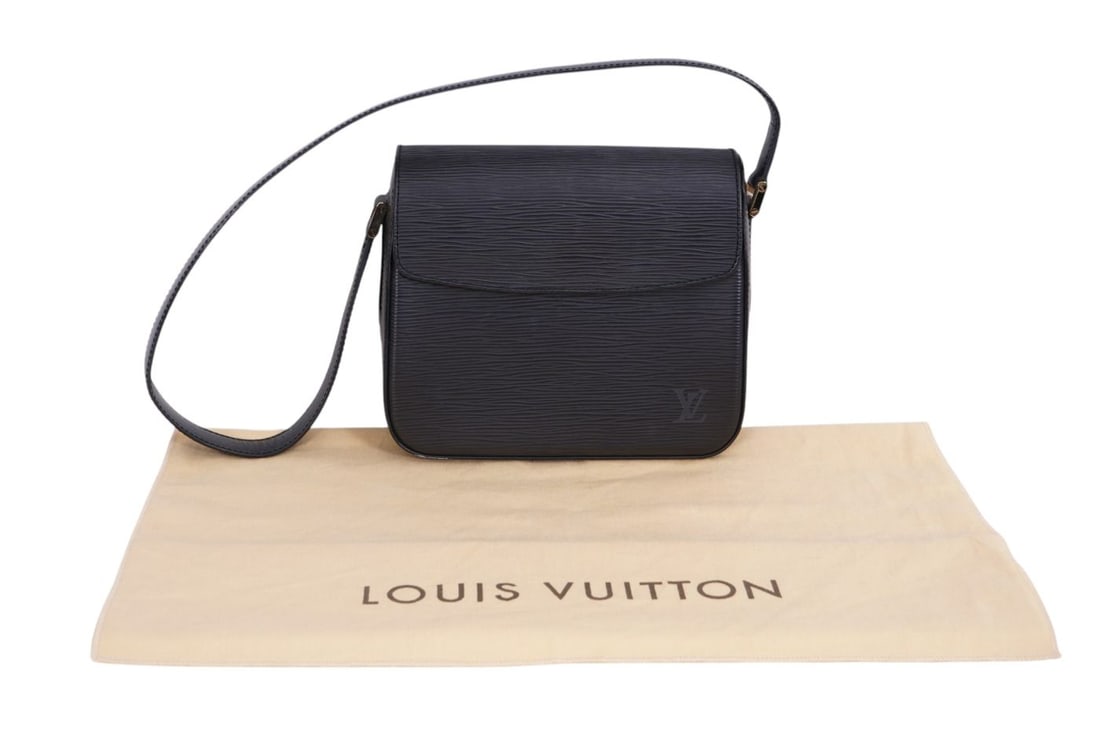 Louis Vuitton Black Buci bag with its signature wave like Epi design highly resistant to water and: Louis Vuitton Black Buci bag with its signature wave like Epi design highly resistant to water and scratches. Structure is minimal rectangle shape with flap close and single flat strap gold tone hardw