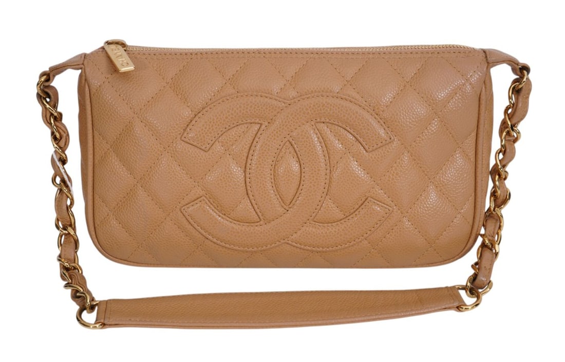 Chanel beige/camel color timeless CC pochette from quilted leather with prominent CC branding.: Chanel beige/camel color timeless CC pochette from quilted leather with prominent CC branding. Condition inside and out has been well maintained. Serial number inside with no card.