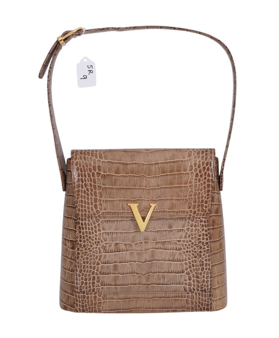 Vintage Valentino crocodile embossed leather shoulder strap bag with the prominent V logo. The: Vintage Valentino crocodile embossed leather shoulder strap bag with the prominent V logo. The timeless style mirrors the 1990s les Sacs rigid structure. Purse shows no signs of Signiant use.