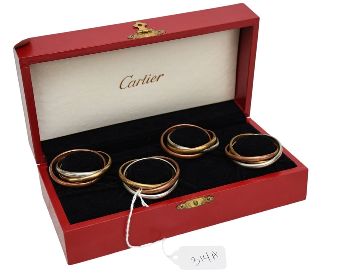 Set of Four Napkin Rings in Original Boxes by Cartier. A beautiful set of four Cartier "Trinity" (1 of 3)