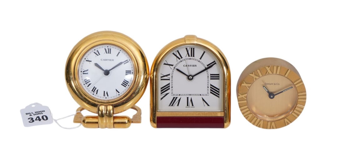 3 small travel clocks: 2 Cartier wind both approx. 3 x 3-1/2 inches. And 1 Tiffany & Co. quartz. (1 of 6)