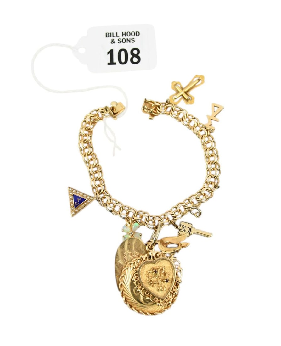 14K Yellow Gold Charm Bracelet. 7" wt. 33.1 grams mostly all 14K except 1 10K gold charm. (1 of 9)