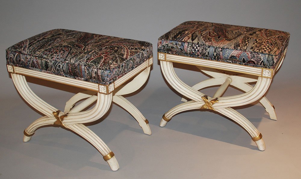 Pair French Style Carved, Painted, & upholstered: Pair French Style Carved, Painted, & upholstered footstools. Condition: good with normal wear. H. 19" W. 22" D. 14"